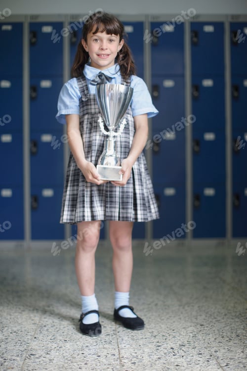 Preview: School girl holding trophy