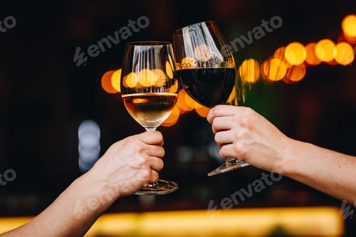 Preview: Two people toasting with wine glasses