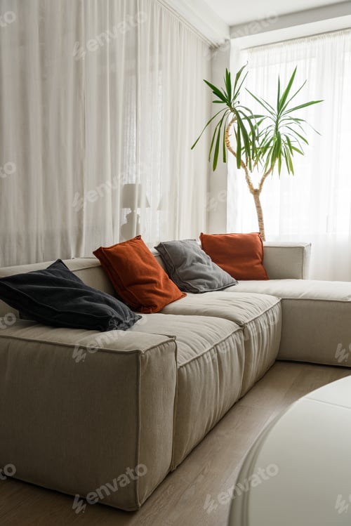 Preview: Soft pillows on cozy sofa in room
