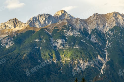 Preview: Beautiful mountain landscape sunset. Scenic view of a colorful sky above the mountains.