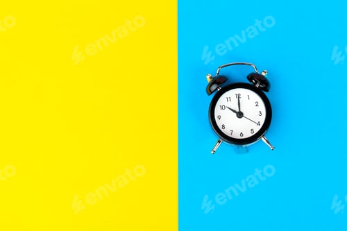 Preview: Black alarm clock on color block yellow and blue background