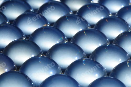 Preview: Close-up large glass balls lie next to each other