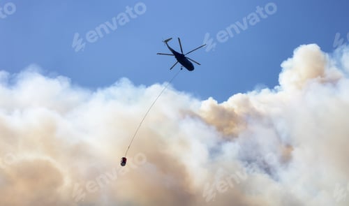 Preview: Wildfire Service Helicopter flying over BC Forest Fire and Smoke on the mountain near Hope
