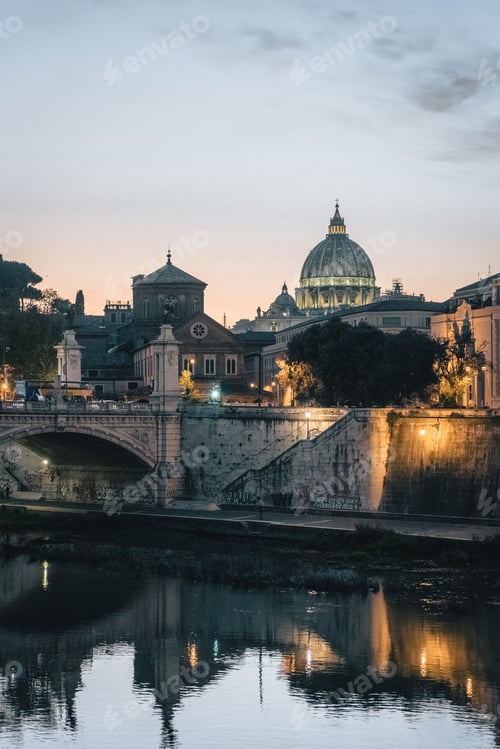 Preview: Vertical shot of buildings and cathedrals near a bridge in Rome, Italy