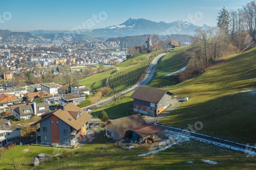 Preview: Town on green slope of mountains