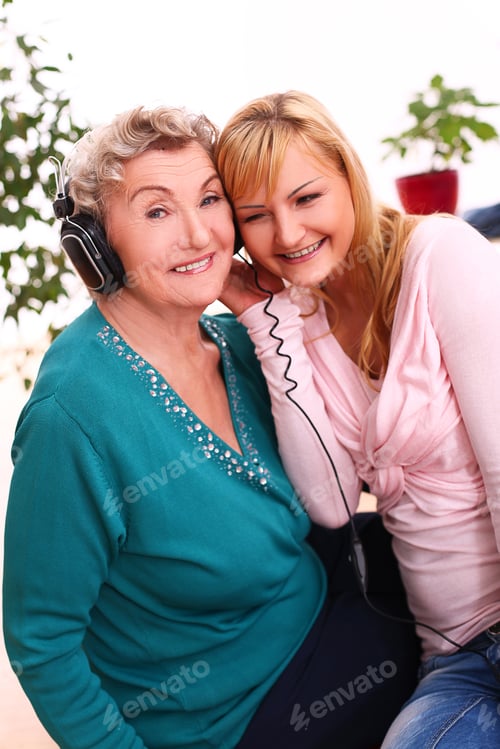 Preview: Woman and Senior Woman Listening to Music Together