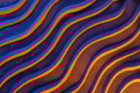 Preview: top view of textured sand with smooth waves and neon color filter