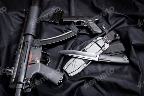 Preview: Rifle, gun, knife with sheath, compass and notebook with pen on on black cloth