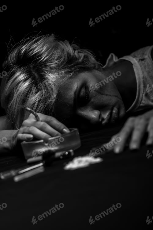 Preview: Young female drug addict on black background.