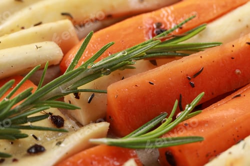 Preview: Slices of parsnip and carrot with rosemary, closeup