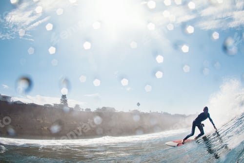 Preview: Mid adult male surfer leaning into wave, Leucadia, California, USA