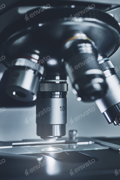 Preview: Modern microscope with metal lens at laboratory.