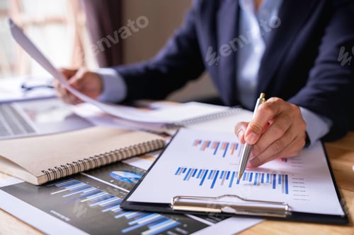 Preview: Businessman Accounting Calculating Cost Economic Financial data, taxes, bank account balance and cal