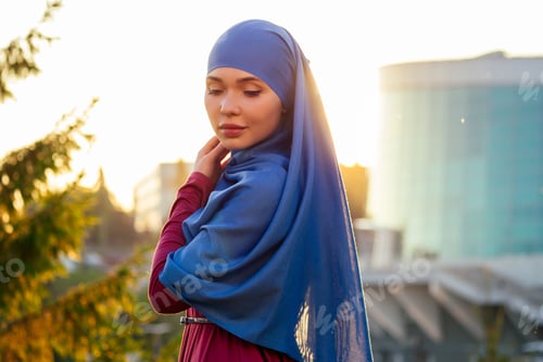 Preview: Portrait of beautiful Muslim woman with green eyes wearing blue scarf