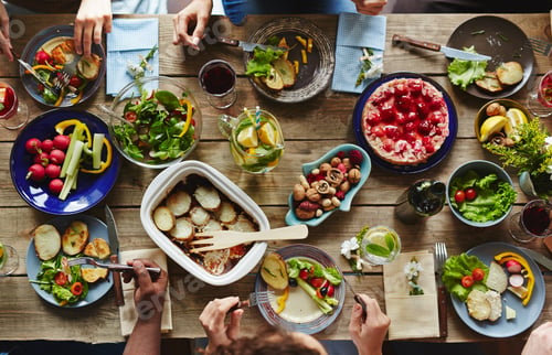 Overhead View of Dining Table with Food and People
