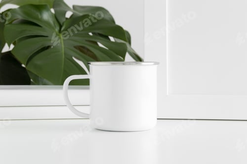 Preview: Enamel mug mockup with workspace accessories and a monstera plant.