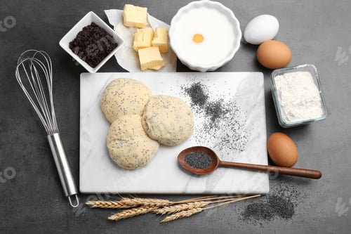 Preview: Flat lay composition with raw dough and ingredients on grey background