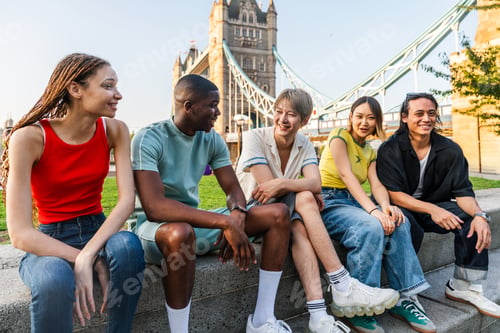 Preview: Multiracial group of happy young friends bonding in London