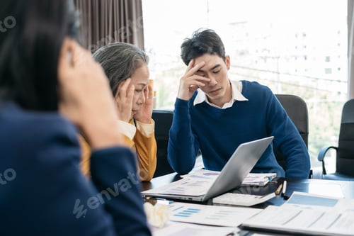 Preview: business team sitting sad and solving problems in the office. Failed teamwork concept