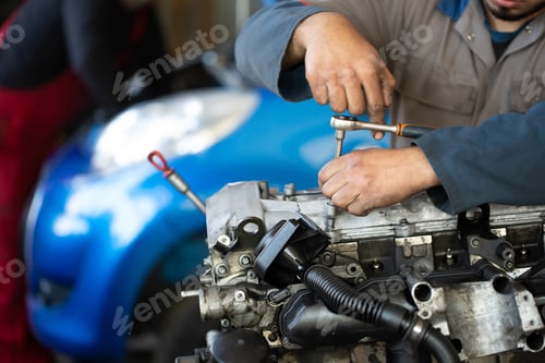 Preview: An auto mechanic repairs an internal combustion engine