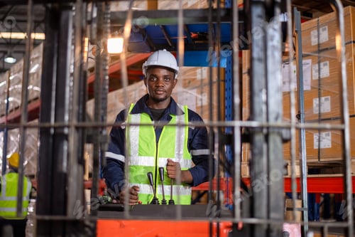 Preview: Worker industry factory drive forklift truck moving goods boxes in warehouse industry production fac