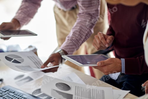 Preview: businessmen with tablet pc and charts at office