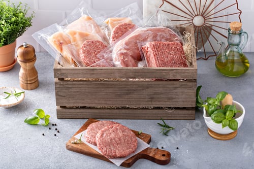 Preview: Meat delivery box, variety of meat chops and packages in a wooden crate