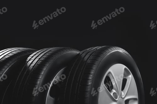 Preview: New car tires with rims on black background, closeup