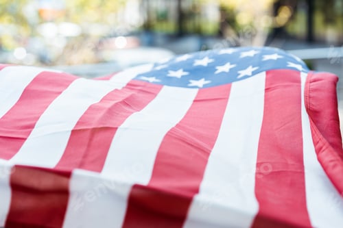 Preview: Selective focus of american flag outdoors at daylight