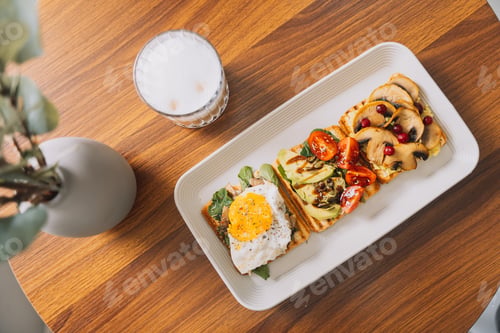 Preview: Breakfast toasts with different toppings on a plate with a cup of coffee