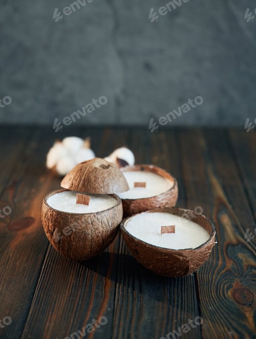 Preview: In shape of coconut. Handmade beautiful decorative candles on the background