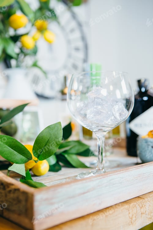 Preview: Close up tray with tangerines and glass