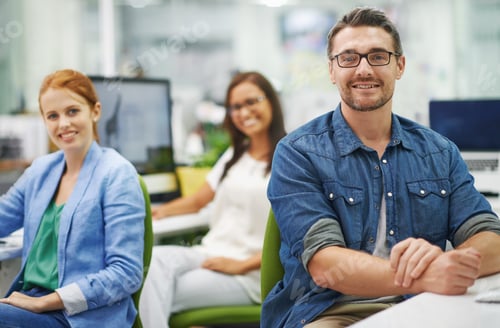 Preview: Work is a treat with colleagues like these. Shot of three smiling colleagues working at the office.
