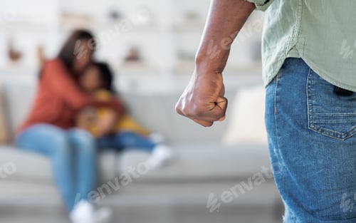 Preview: Domestic Violence. African American Man Threatening Wife And Daughter With His Fist