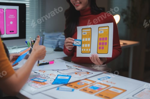 Preview: Ux ui designers working on mobile app interface wireframe