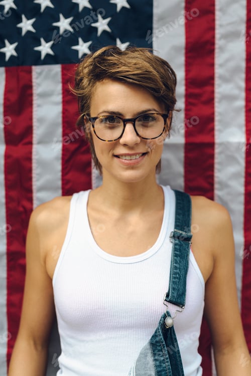 Preview: Portrait of blond woman in front of American Flag
