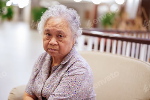 Preview: Asian senior or elderly old lady woman sitting and waiting her relative
