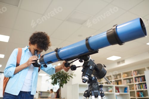 Preview: Boy Looking Through Telescope