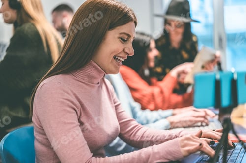 Preview: Young blogger woman working inside modern startup office - Focus on face