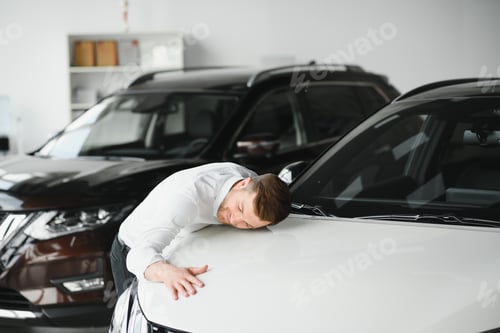 Preview: Man buying a car at a showroom