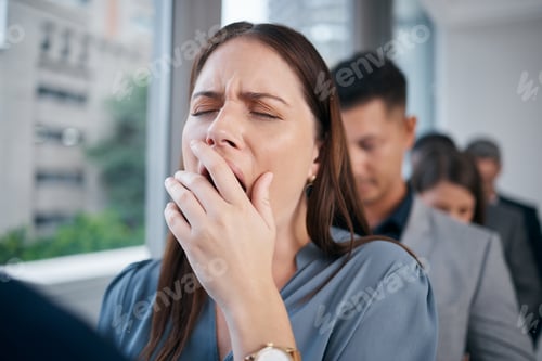 Preview: Interview nerves kept me up all night. Shot of a young businesswoman yawning in a waiting room.