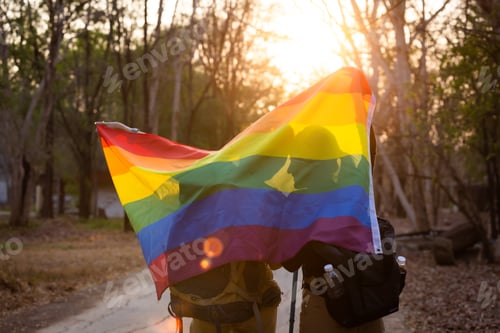 Preview: Lesbian couple at gay pride with rainbow flag