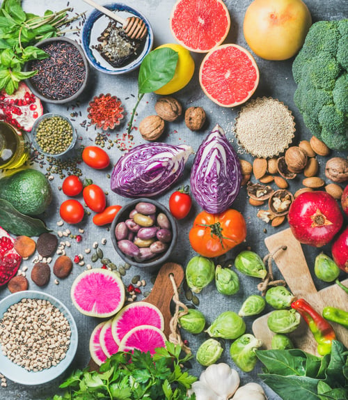 Preview: Healthy raw food variety over grey concrete background