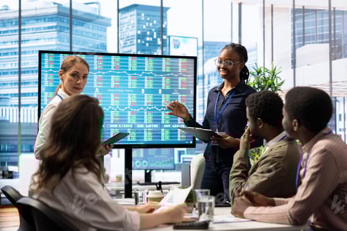 Preview: Employees gather to brainstorm ideas and create strategies in high end boardroom