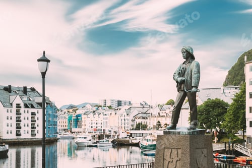 Preview: Alesund, Norway. Statue Of Young Sailor-fisher Boy On Brosundet Canal. Old Wooden Houses In Summer