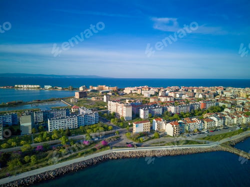 Preview: Black Sea against backdrop of town Pomorie in Bulgaria under a cloudy sky