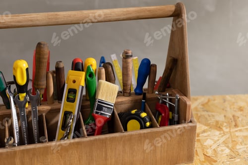 Preview: Construction tools and toolbox at wooden table background. Tools kit and tool box