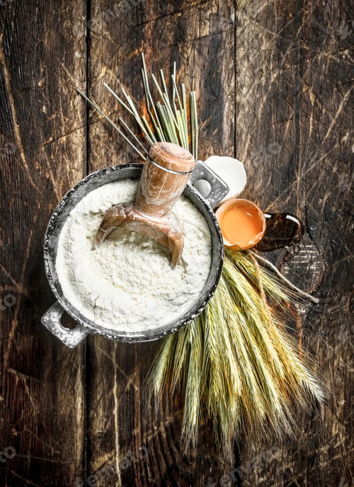 Preview: Flour in a bowl with chicken egg.
