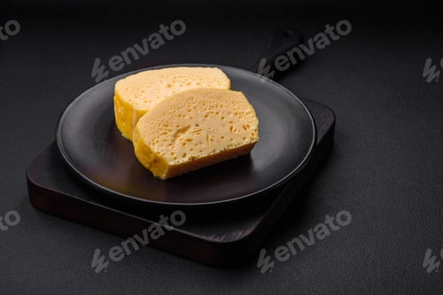 Preview: Delicious omelet with milk, spices and herbs cut into large pieces