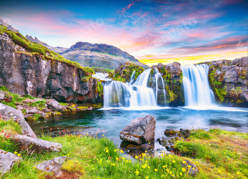 Preview: Dramatic view on Kirkjufellsfoss waterfall near Kirkjufell mountain at sunset